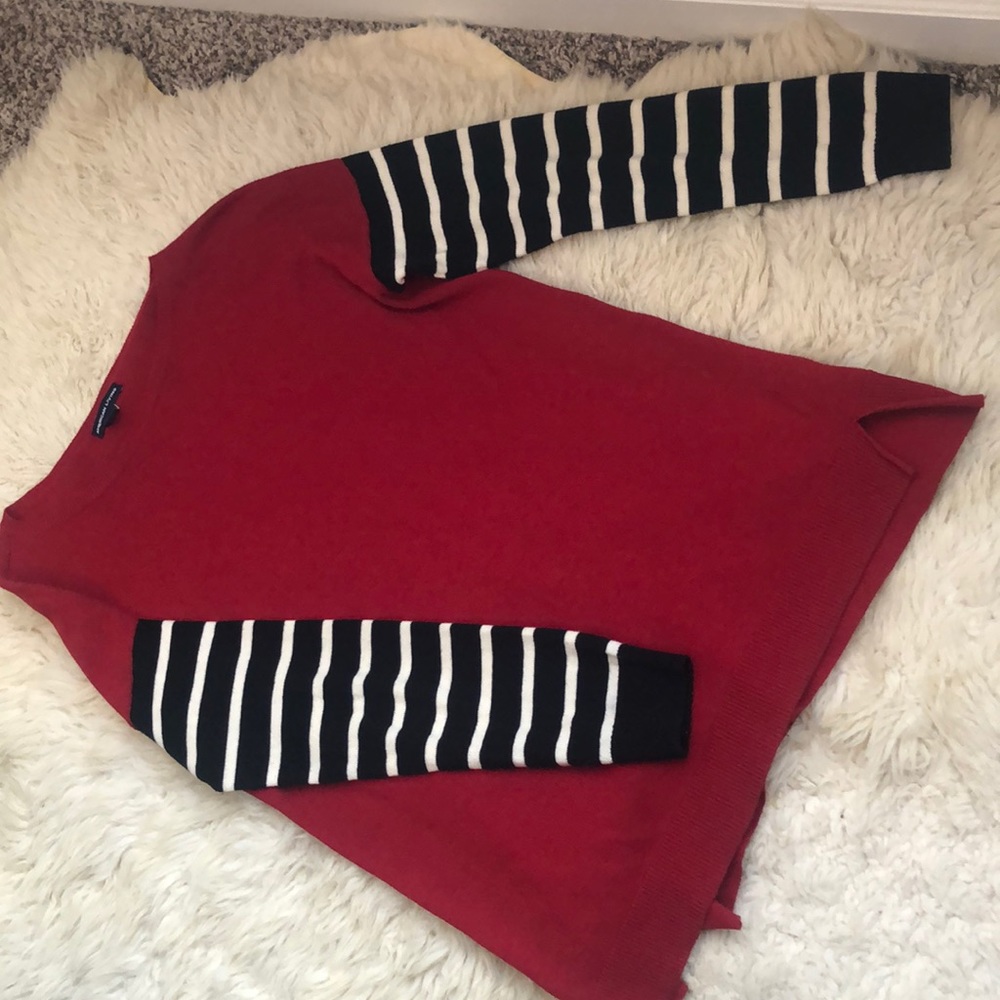 Red sweater with striped sleeves
